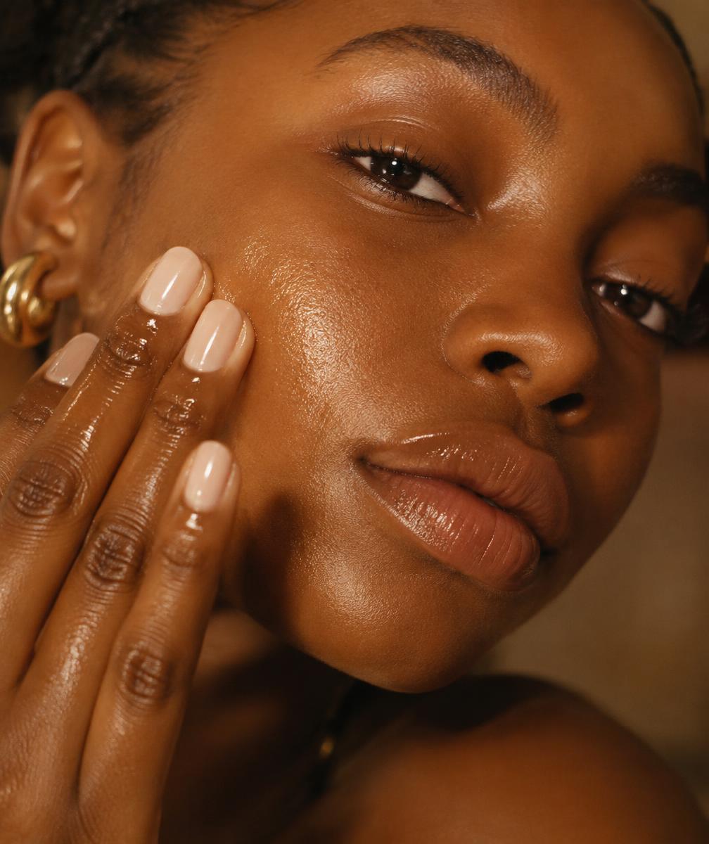 Woman applying facial oil